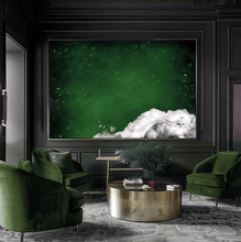 A modern living room featuring a large green minimalist painting on the wall. The painting future dark emerald green colors and a bit of fluffy white clouds in the one corner. The room has a olive green-colored arm chairs with, a gold modern coffee table, and a minimalist luxury decor style, creating a glam and elegant atmosphere.