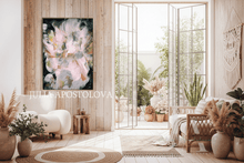 Modern living room with floral artwork, plants, and a large window.