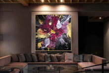 Oversized Floral Abstract painting on a wall above a sofa in a dimly lit room