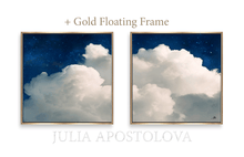Two framed cloud paintings with a gold floating frames by artist Julia Apostolova.