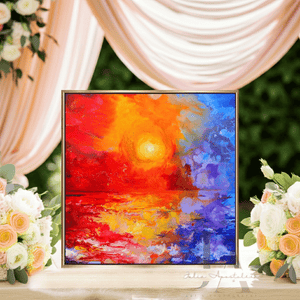 Colorful abstract painting on a table with floral arrangements and draped fabric in the background