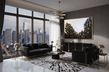 Modern living room with black sofa, marble floor, cityscape view, and large white black gold leaf abstract painting by artist Julia Apostolova. 
