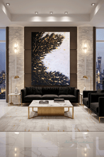 Modern living room with black sofa, marble coffee table, and large black white gold leaf abstract painting, by artist Julia Apostolova.