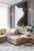Modern living room with a beige sofa, decorative pillows, and a large abstract  white black gold leaf painting on the wall, by artist Julia Apostolova