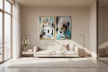 Modern living room with gold leaf abstract art set on the wall by artist Julia Apostolova and a white sofa.