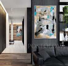 Abstract wall art print featuring a modern composition of gray, black, and turquoise brushstrokes with gold accents, displayed in a contemporary living room setting.