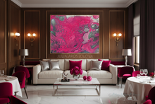 A large abstract wall art print with vivid pink, magenta, and silver marbled colors hangs above a cream sofa in a luxurious modern living room with dark wood paneling, gold sconces, and red upholstered dining chairs.