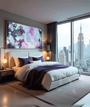 Modern bedroom with cityscape view, bed, and purple pink artwork on wall, by artist Julia Apostolova