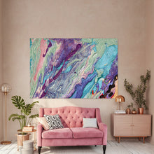 A large abstract canvas print with swirling purple, teal, pink, and cream paint patterns hangs on a dark charcoal wall above a pink velvet sofa in a styled living room.