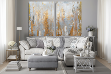 Living room with a gray sectional sofa, decorative items, neutral abstract art on the wall, with gray, silver and gold leaf, by artist Julia Apostolova.