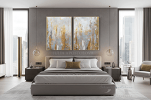 Modern bedroom with a bed, side tables, and silver gold neutral abstract wall art set on the wall, over the bed.