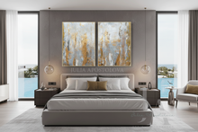 Modern bedroom with a bed, side tables, and silver gold neutral abstract wall art set on the wall, over the bed.