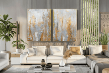 Modern living room with abstract art, sofa, and decor elements.