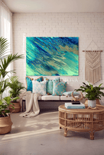 Boho Living room with a large ocean abstract painting, sofa, and decorative elements.