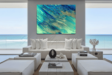 Modern living room with a large ocean abstract painting of blue and green on a wall by artist Julia Apostolova.