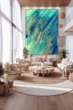 Modern living room with a large teal blue ocean abstract painting on the wall, by artist Julia Apostolova
