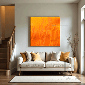 A cozy and inviting Livingroom with a large framed minimalist abstract painting on the wall.