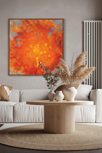 Modern living room with a large orange abstract painting, white sofa, and wooden coffee table.