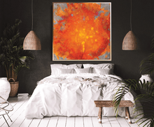 Modern bedroom with a bed, orange abstract art, and plants.