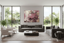Modern living room with gray sofa, white chairs, and abstract painting on wall with pastel pink, ivory, and gold colors.