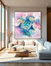 Modern living room with a colorful pastel pink abstract painting on the wall.