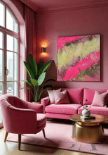 A chic contemporary living room space featuring a bold contrast of colors and textures. The focal point is a large minimalist painting in fuchsia pink color, gold, and greens, a pink plush velvet sofa, exuding luxury and comfort , adorned with decorative pink cushions , a round old coffee table next to it, pink colored walls, and a large window overlooking a cityscape.  There are tall plants in the corners, creating a warm and inviting atmosphere 