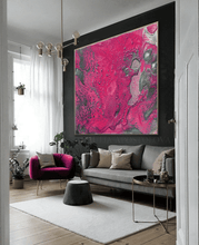 A modern and luxurious living room with a large gray sofa, fuchsia pink arm chair, and a very large fuchsia pink artwork on the wall with beautiful silver shinning details. The room has large windows, a low chrome table , a light gray carpet, and plush seating areas