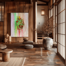 A modern Japanese-style interior room with wooden walls, shoji screens, low wooden tables, woven rugs, and a large abstract painting hanging on the wall. The painting features vertical brushstrokes in green, red, pink, and yellow on a pale background.