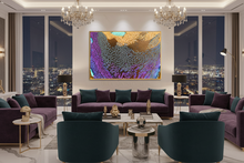 A luxury modern living room featuring a large, vibrant abstract canvas print with gold, purple, and teal colors hanging on the wall above a purple sofa. The room is styled with two crystal chandeliers, large windows showing a night city skyline, and contemporary furniture including purple sofas, teal armchairs, and marble tables.