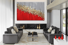 Modern living room with large red gold silver painting with real gold leaf, by artist Julia Apostolova. The room features gray sofas, a coffee table, gold red decorative vases, and a garden window view.