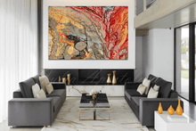 Modern living room with gray sofas, a marble coffee table, and abstract art on the wall.