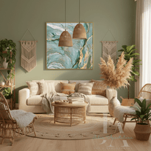 Cozy living room with a beige sofa, wicker coffee table, and sage green gold abstract artwork, by artist Julia Apostolova.