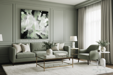 Modern sage green living room with sofa, armchair, and abstract painting on the wall.