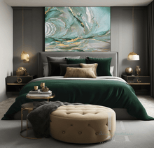 Modern bedroom with a large bed, sage green gold leaf abstract painting, and decorative items.