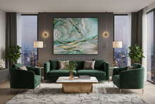 Modern living room with green sofas, a coffee table, and sage green abstract artwork on a gray wall with gold leaf, by artist Julia Apostolova.