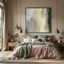 Modern bedroom with a bed, sage green abstract painting, and decorative elements.