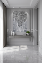 Modern interior with a silver metallic decorative wall art and marble floor.