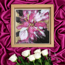Framed abstract painting of a pink flower on a pink satin background with white roses.