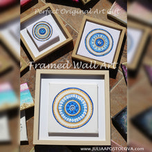 A mandala-style original paintings, with glitter gold blue colors, in natural shadow box frame.  The painting canvas features small greek eye design in the center. Ideal art gift for Christmas, birthday, and any occasion. 
