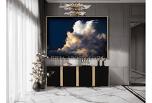 Modern interior with a large framed artwork of clouds on a wall, by artist Julia Apostolova