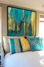 Bedroom with abstract art above the bed featuring teal and gold colors.