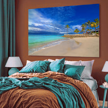 Bedroom with a large beach scene painting on the wall