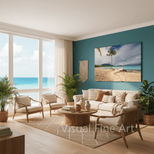 Modern living room with beach-themed decor and large windows overlooking the ocean.