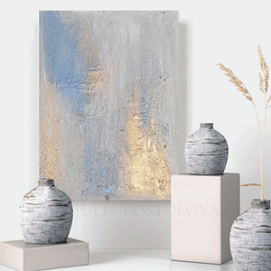Decorative setting with abstract painting and textured vases on a white surface