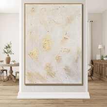 Abstract art piece with gold accents in a modern living room setting