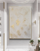 Decorative wall art with gold accents in a modern interior setting