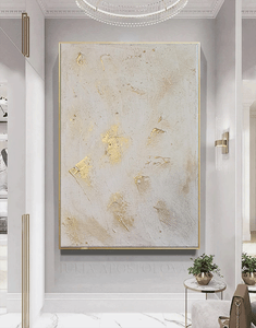 Decorative wall art with gold accents in a modern interior setting