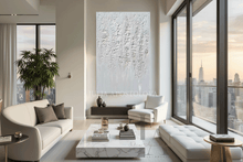 Modern living room with large windows, white furniture, cityscape view, and wabi sabi white 3d textured artwork by artist Julia Apostolova