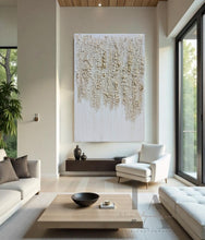 Modern living room with large abstract painting, white sofa, and wooden coffee table.