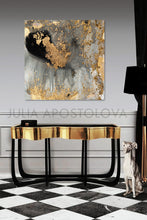 A contemporary abstract gold leaf canvas art hanging over a modern gold cadenza with a focus on the artwork featuring gold leaf and metallic accents.
